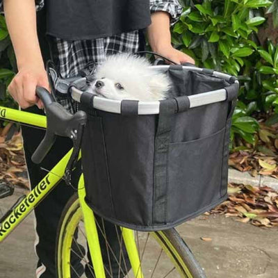 Panier vélo chien DogBasket noir personnage blanc dehors chien